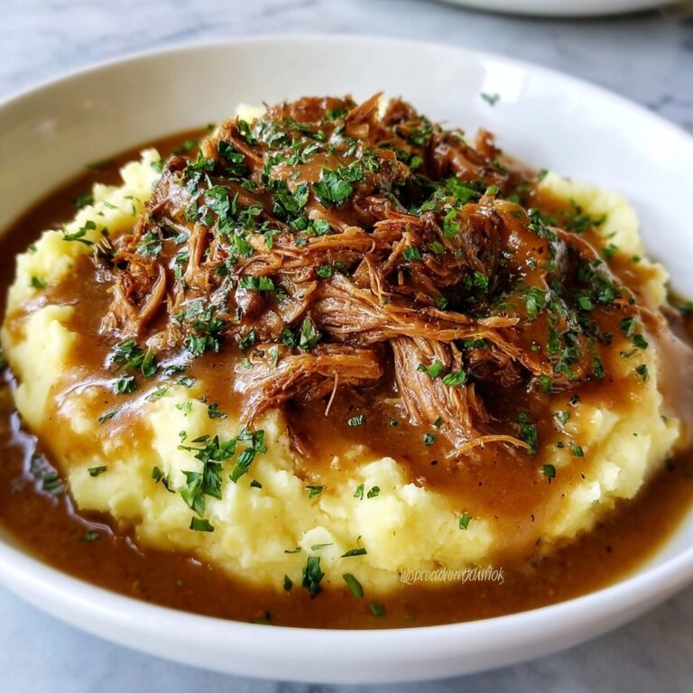 Crockpot Shredded Chicken with Ranch Gravy Over Mashed Potatoes Recipe